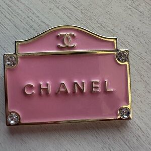 Pink beautiful Chanel brooch.